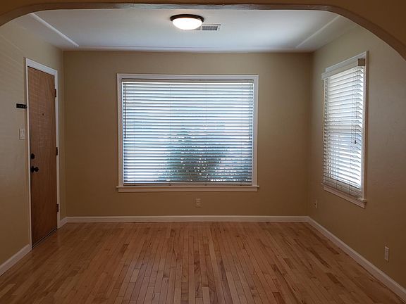 Living room with beautiful wood flooring.