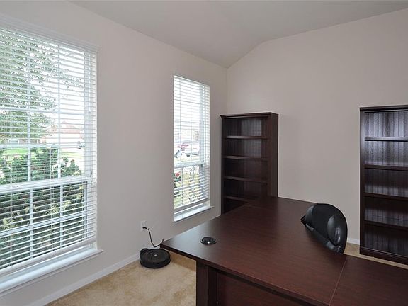 The private study is conveniently located at the front of the home off the entry. It could also serve as a formal living room or playroom.