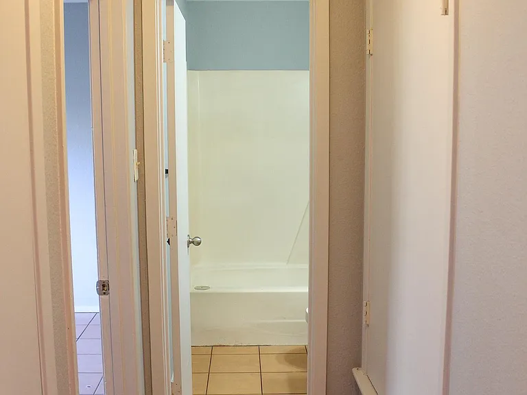 Hall leading to Master bedroom, hall linen closet, and bathroom