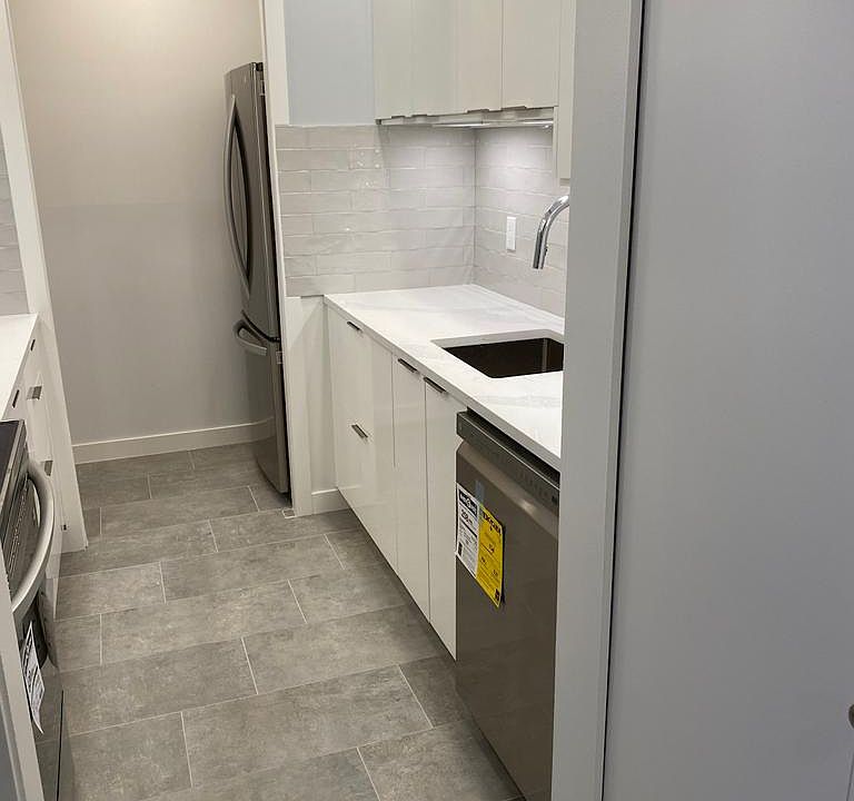 Kitchen with lots of cabinets and drawers.