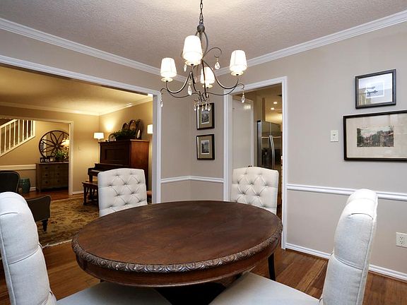 Formal dining room with entry to the kitchen.