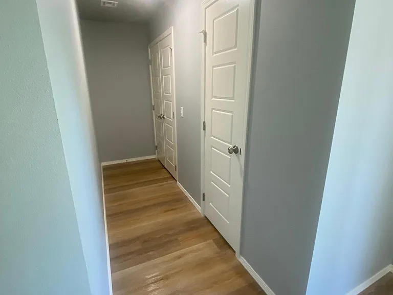 Downstairs hallway to laundry and 1/2 bath