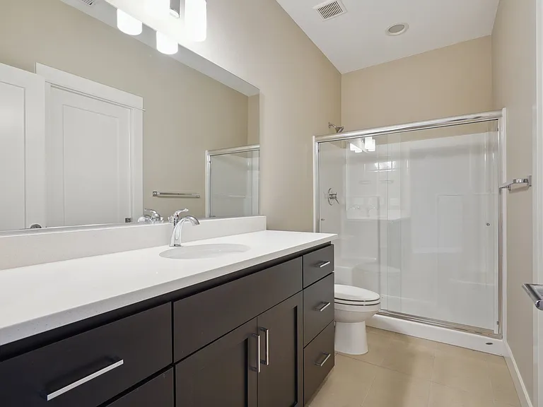 Junior Suite attached full bath with dual doors.