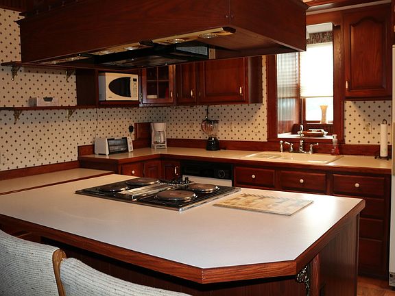 Small kitchen appliances included - microwave, toaster oven, blender, coffee maker.