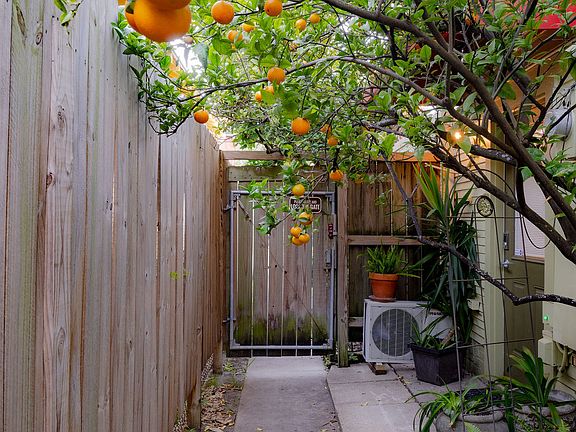 Gated Side Entrance Leads to the Front of the House