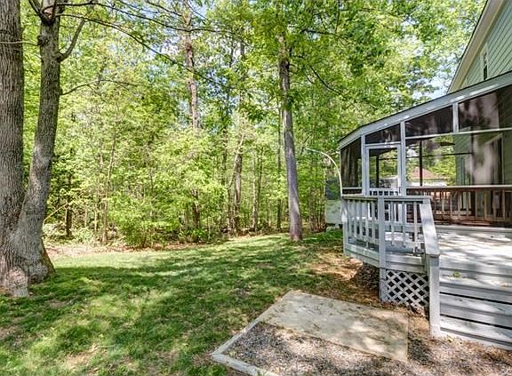 Screen porch and deck overlook woods providing plenty of privacy!