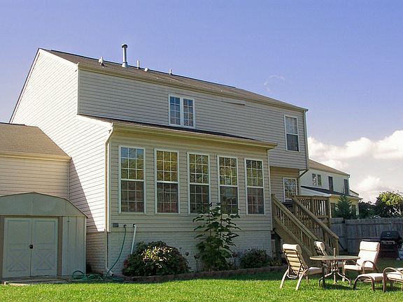 rear of house looking at deck and sunroom