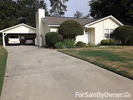 Front with 2 car carport