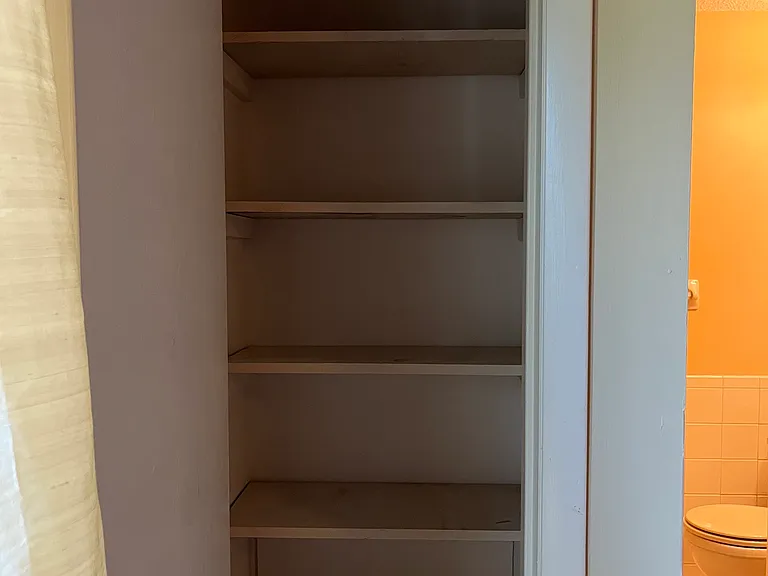Full size linen closet for invaluable extra storage.