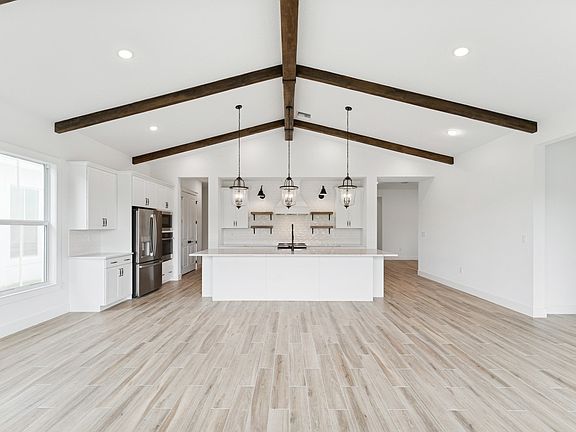 Vaulted ceiling showcases stained beams
