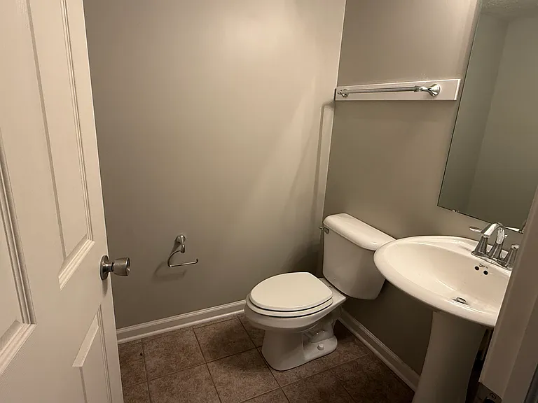A first floor bathroom with a large coat closet for added convenience. There is a bathroom on each floor.