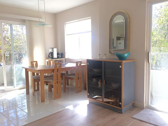 Dining area with window and 3rd balcony facing South