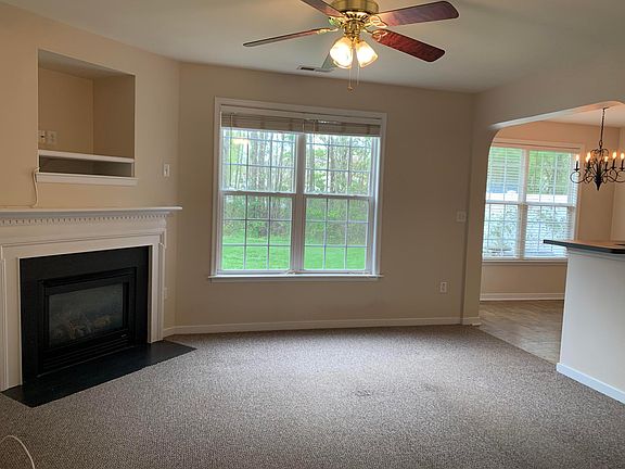 Open floor plan with gas fireplace. Lots of natural light. Ceiling fans throughout.