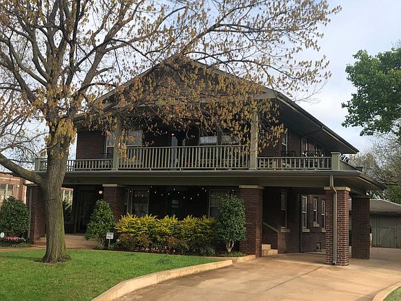 Covered parking and a shared driveway with upstairs occupant.