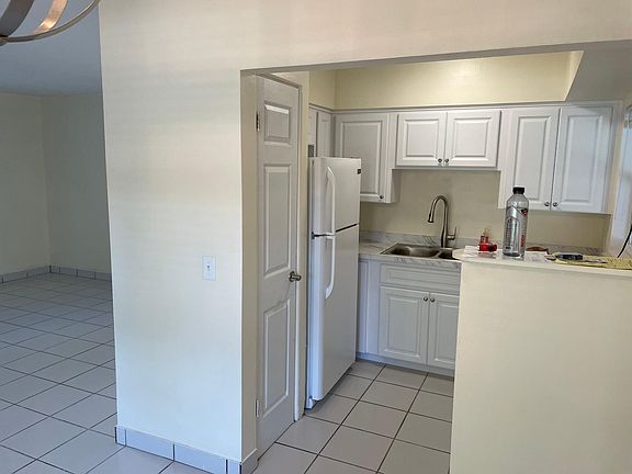 In the front door, kitchen and dining area.