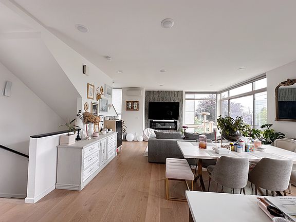 Living room, dining, kitchen with fireplace