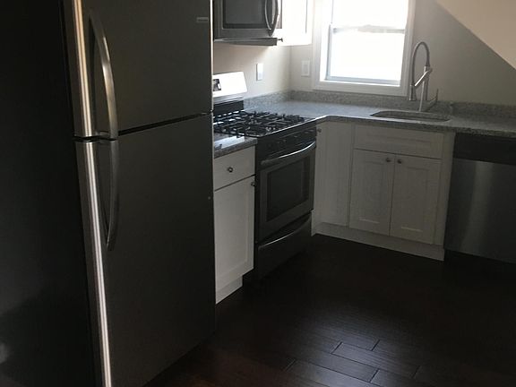 Kitchen with stainless steel appliances and white cabinets