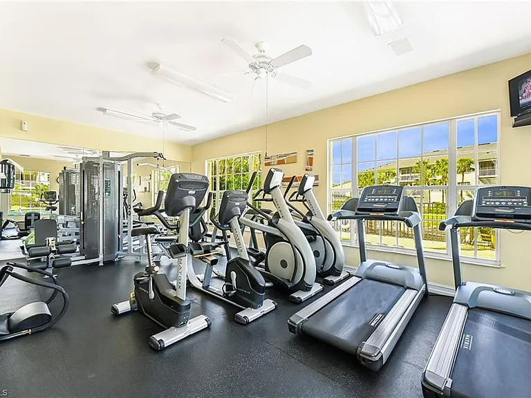 Fitness center on property in addition to large Pelican Bay fitness center