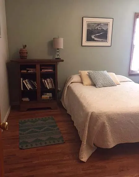 2nd bedroom with corner windows facing south and west, smaller closet