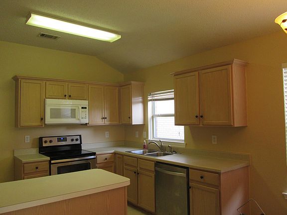 Open and bright kitchen with new stove