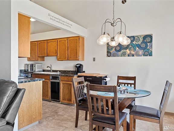 Just outside of the kitchen is a nice dining area, with wonderful views of the well maintained grounds in Sunset Plaza.