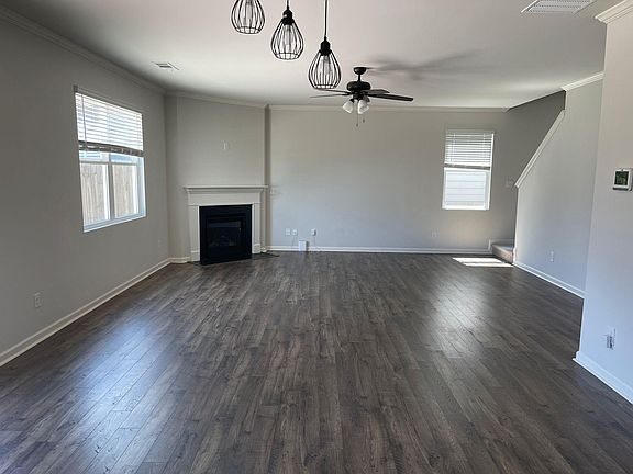 LivingRoom with FirePlace and Fan.