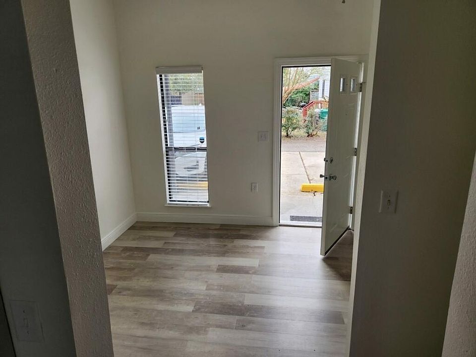 Living room area looking out the front door.