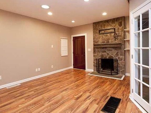 Living room with wood burning fire place