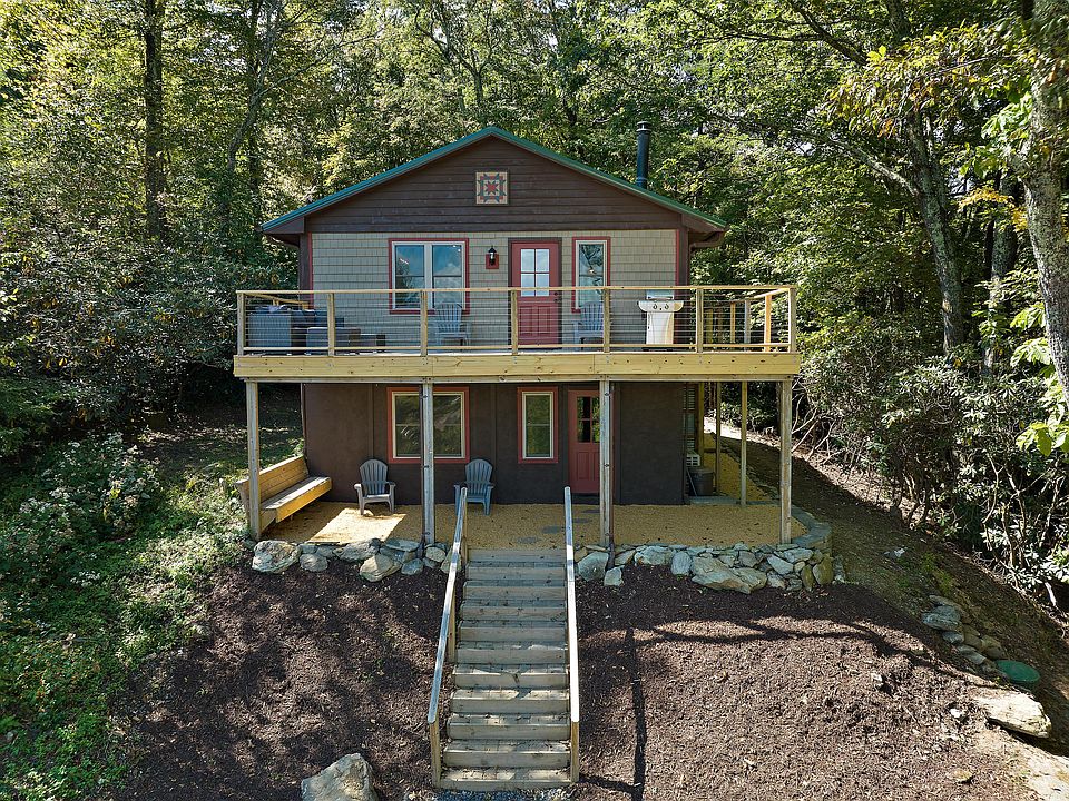 Front view of home, with ample parking, sited on nearly one acre.
