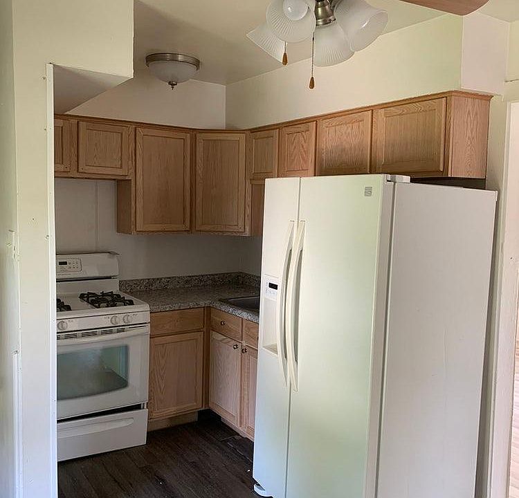Kitchen with new Cabinets and counter tops. New Fans