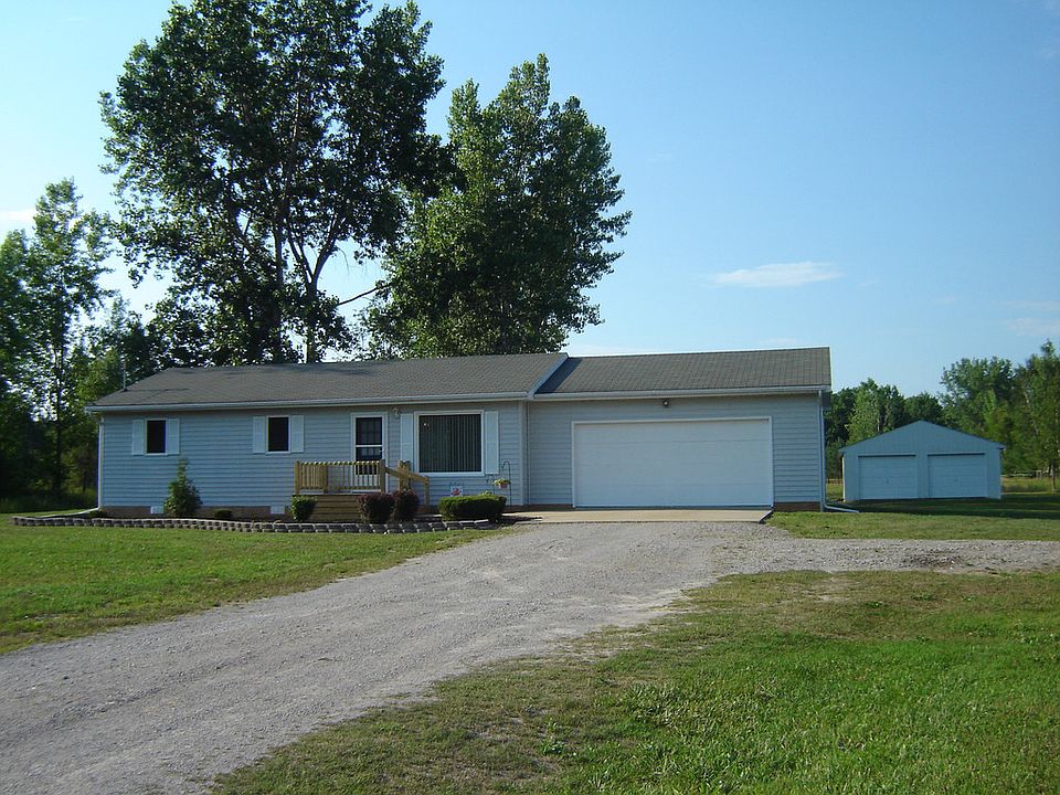 Peaceful Country living but an easy 10 minutes drive to town.  There is "room to grow" on this 1 acre country setting.  Ride your bike or walk the dog on the street that has minimal traffic.  In addition to the 2 car attached garage there is a 32x24 pole barn with cement floor.The home has had some recent improvements and is ready for new buyers to enjoy.  The home has city water and natural gas.Come home to quiet, peaceful surroundings!