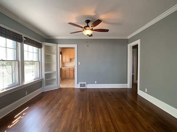 Dining area includes open shelving space and large windows for lots of natural light.