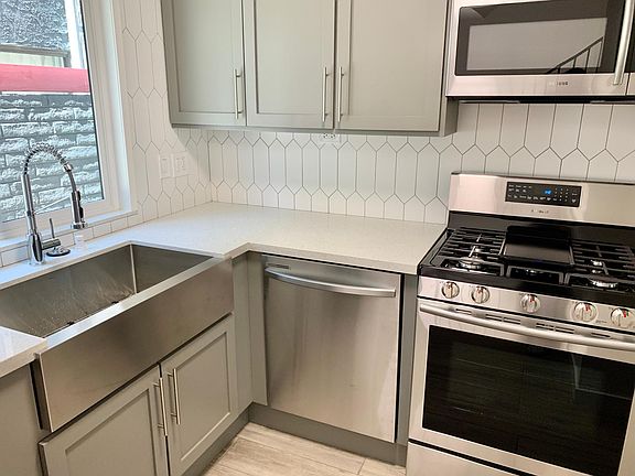 Newly renovated kitchen features stainless steel appliances