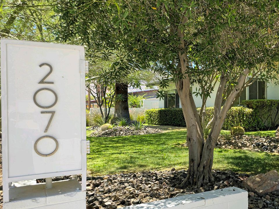 Front of house with mature trees
