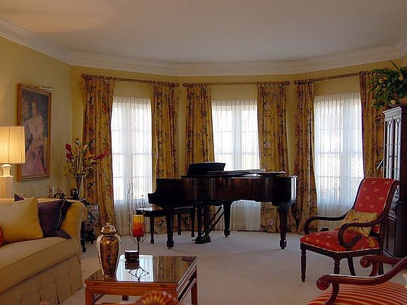 A living room large enough for the piano and then some!