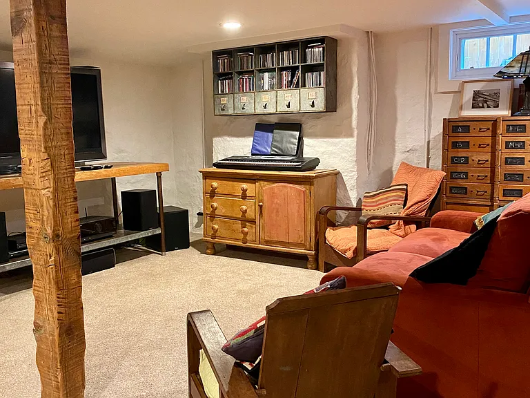 The basement has a full rec room, a laundry room, and a storage room.