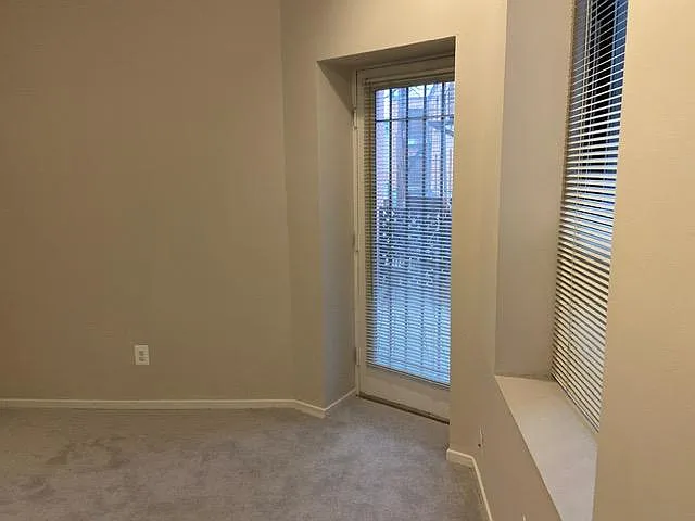 Bedroom 1, door out to balcony