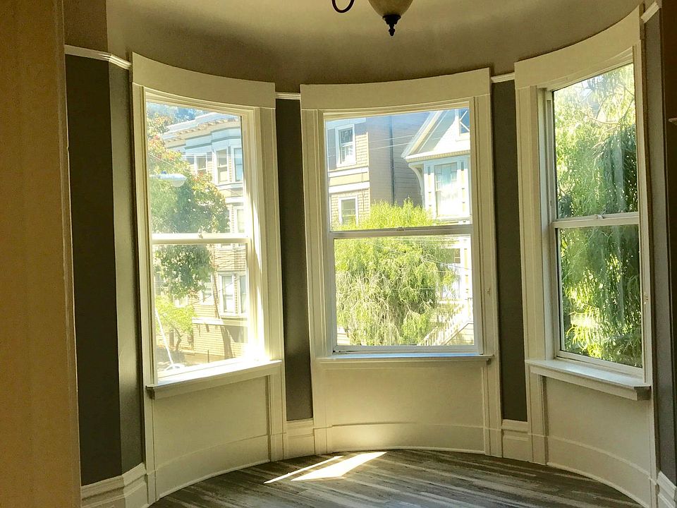Bedroom with decorative fireplace