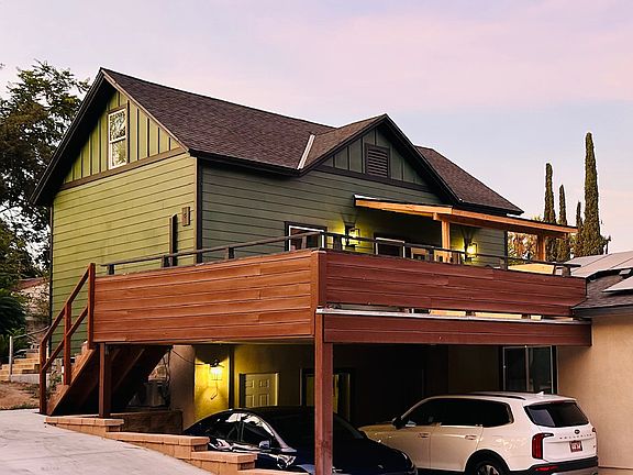 Home is on 2nd story with huge private deck in front and private fenced yard in rear.