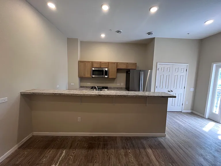 Brand new kitchen with tall ceilings, countertops and all new electrical stainless steel appliances.