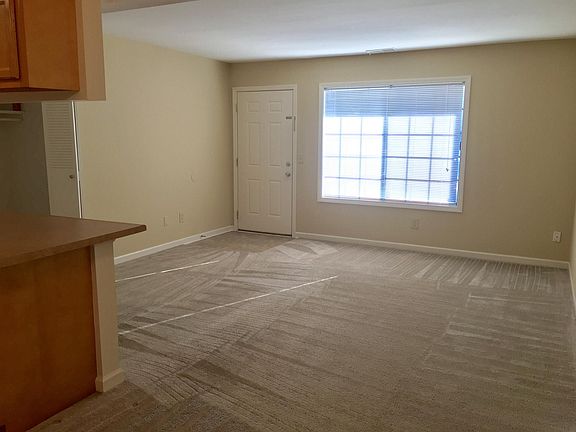 Large Living room window and tiled entry