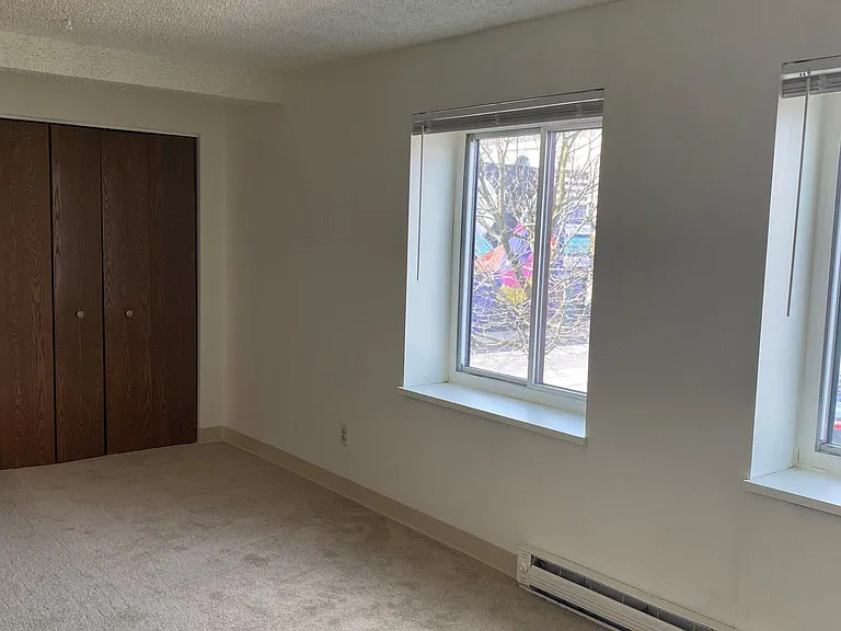 Bedroom/Living with full row of closet space