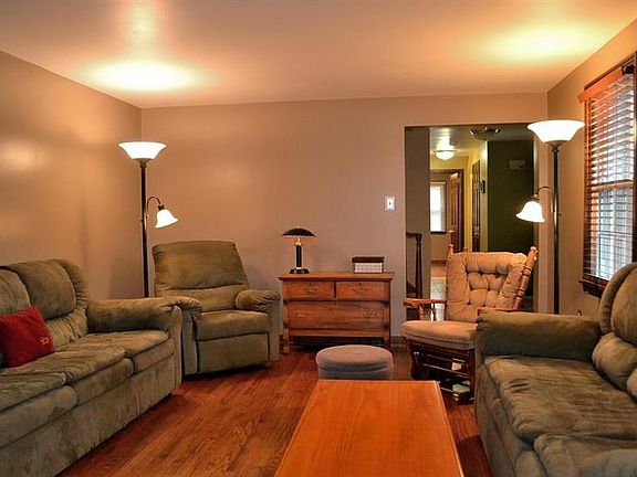 LIVING ROOM.  The living room is massive.  The hardwood, complemented by the wood blinds is beautiful--a perfect place to relax 