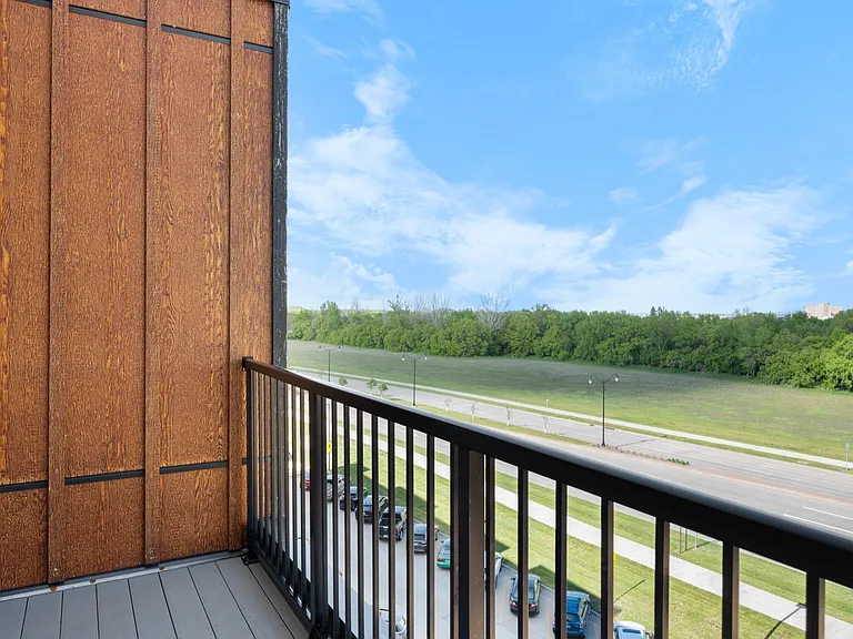 Inviting balcony with serene view of lush greenery and blue skies, perfect for relaxing and enjoying nature. Inviting balcony with serene view of lush greenery and blue skies, perfect for relaxing and enjoying nature.