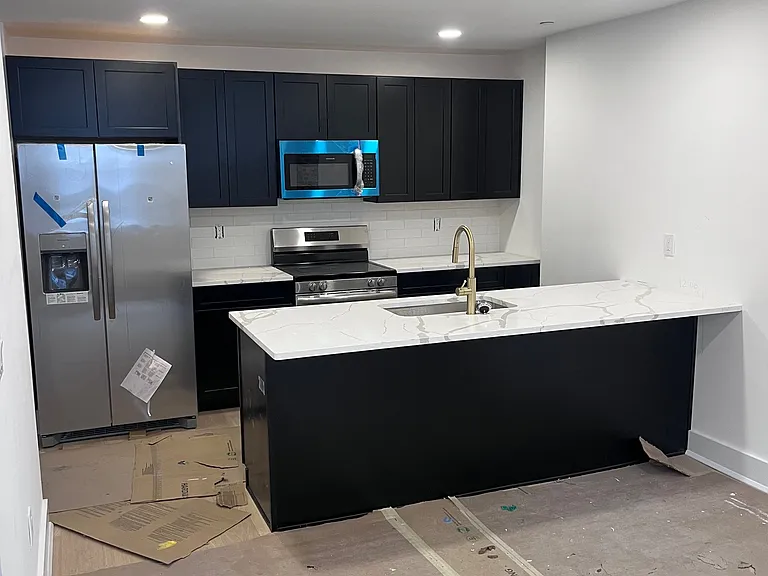 Designer Kitchens: High-end quartz countertops, elegant shaker cabinetry, custom tile backsplashes, and full-size stainless steel appliances. *Layout presented is from apartment 1 - each unit has a unique kitchen layout*