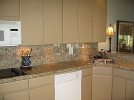 The kitchen has been remodeled with granite counters