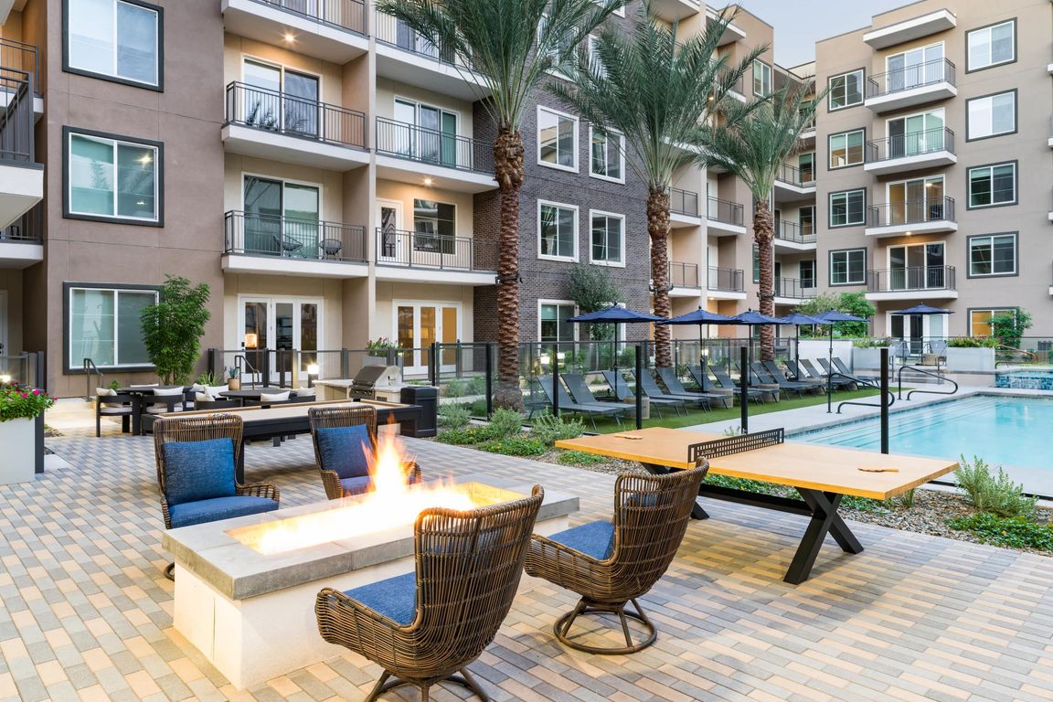 Enjoy poolside lounging, fireside seating, and a quick game of ping pong_all just steps from your apartment home at Modera Kierland.