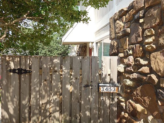 This unit has a privacy fenced front porch.