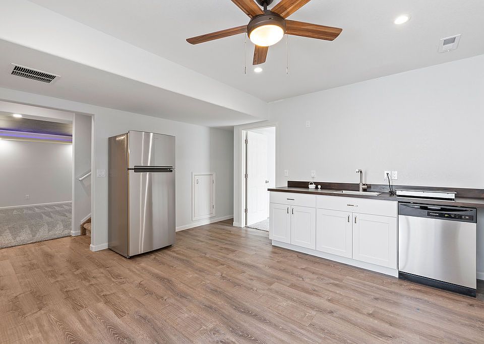 Newly refinished kitchenette with brand new refrigerator/freezer, dish washer, and induction stovetop.