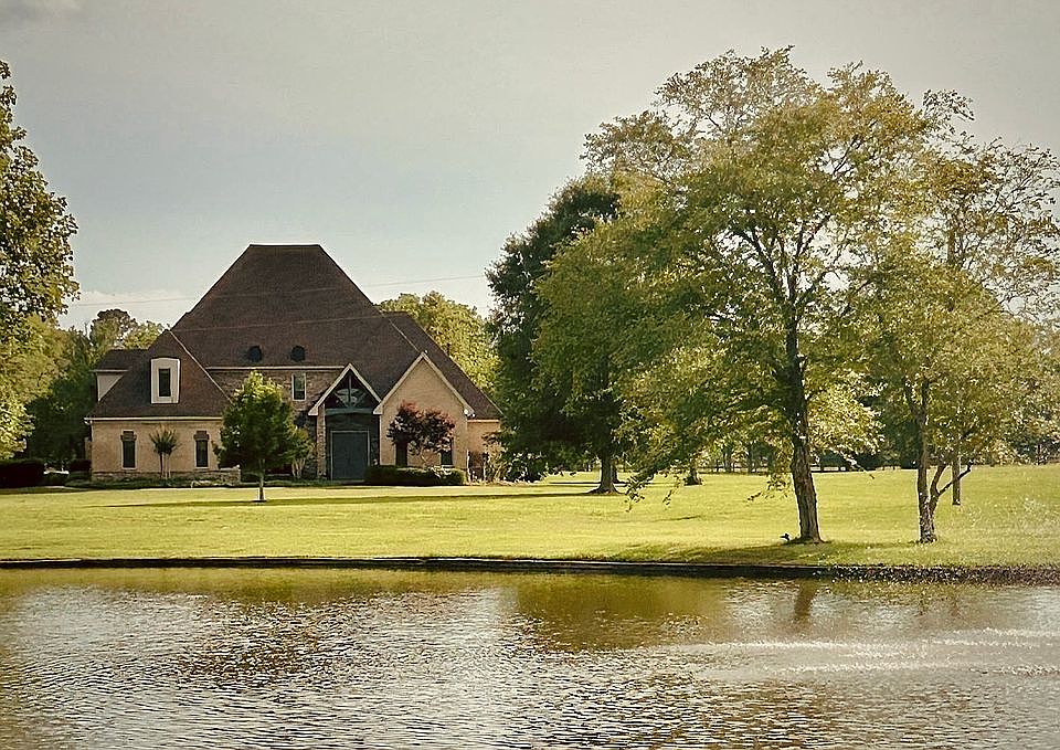 Front of home, facing pond